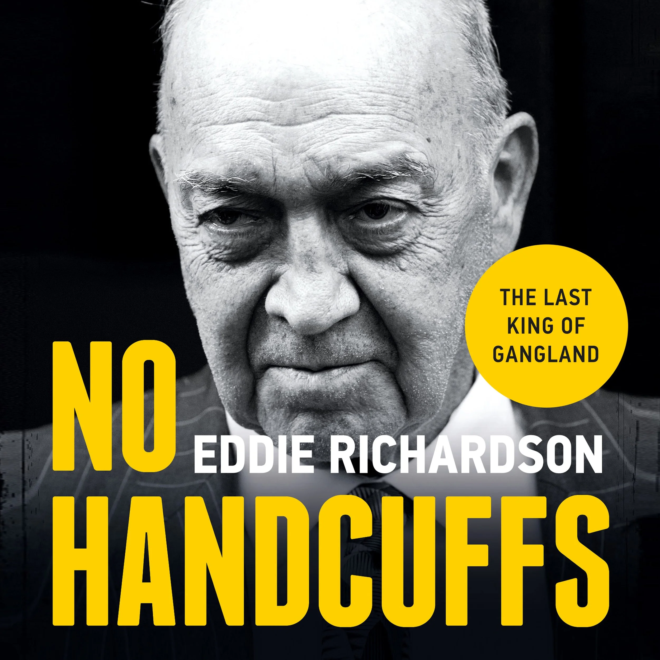 Close-up of an elderly man's face with heavy wrinkles, gray hair, and partially visible clothing, against a dark background with yellow and white text overlay.