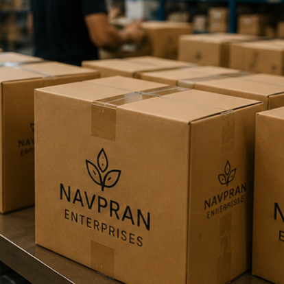 Multiple cardboard boxes labeled Navpran Enterprises on a warehouse table.