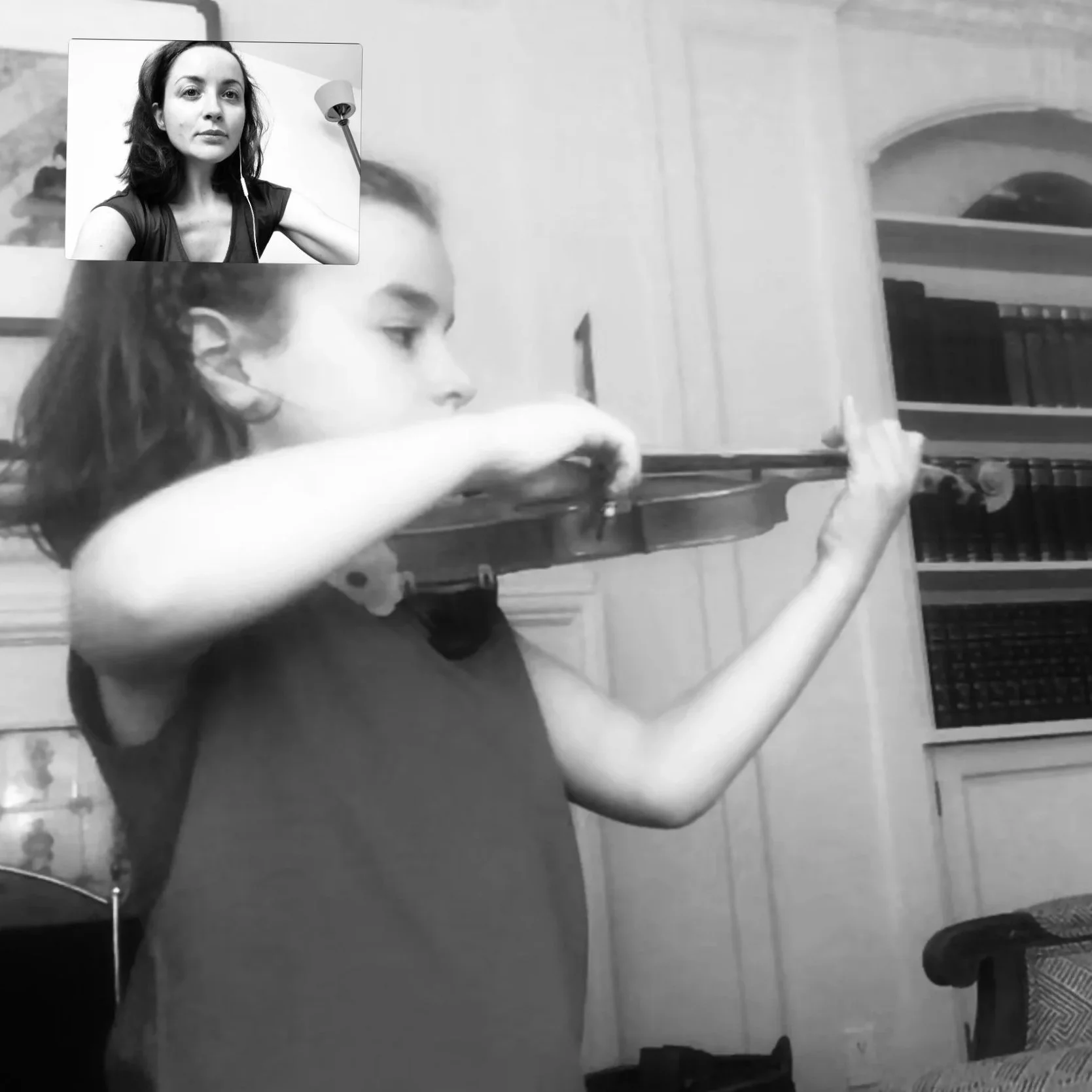 Young violin student demonstrating correct violin posture and proper bow hold during a lesson.