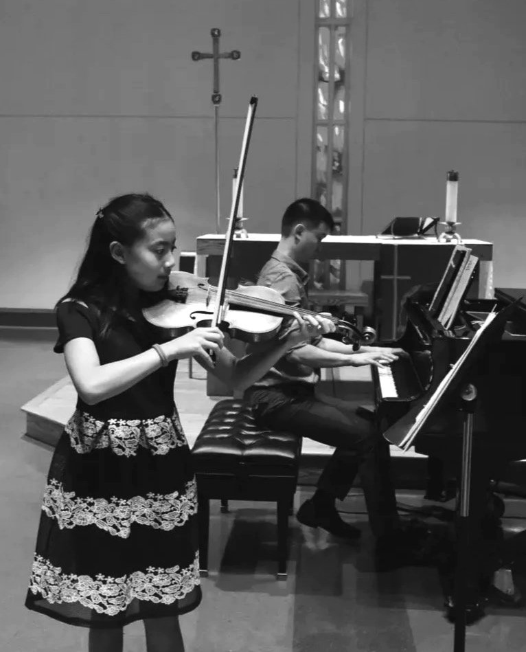 Violin student performs at the studio recital.