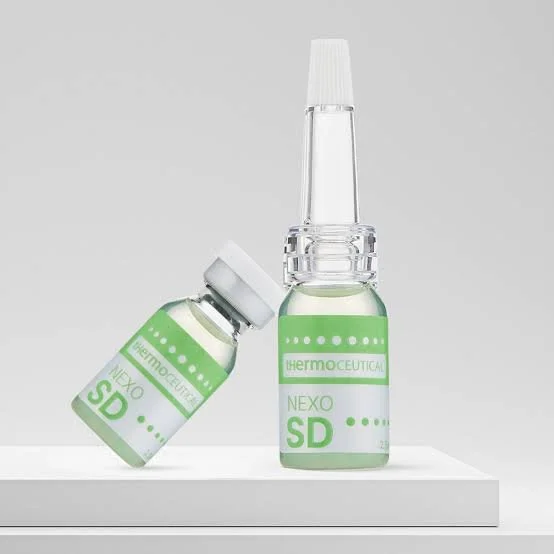 Two bottles labelled SD. SD Booster  Skin Detox Revitalization & Brightening protects against free radicals and evens out the complexion.