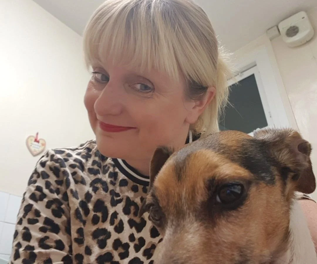 Lady holding her Jack Russell