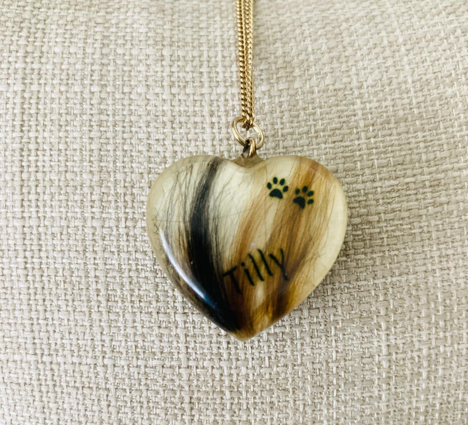 Heart shaped necklace with fur, paws and the name Tilly