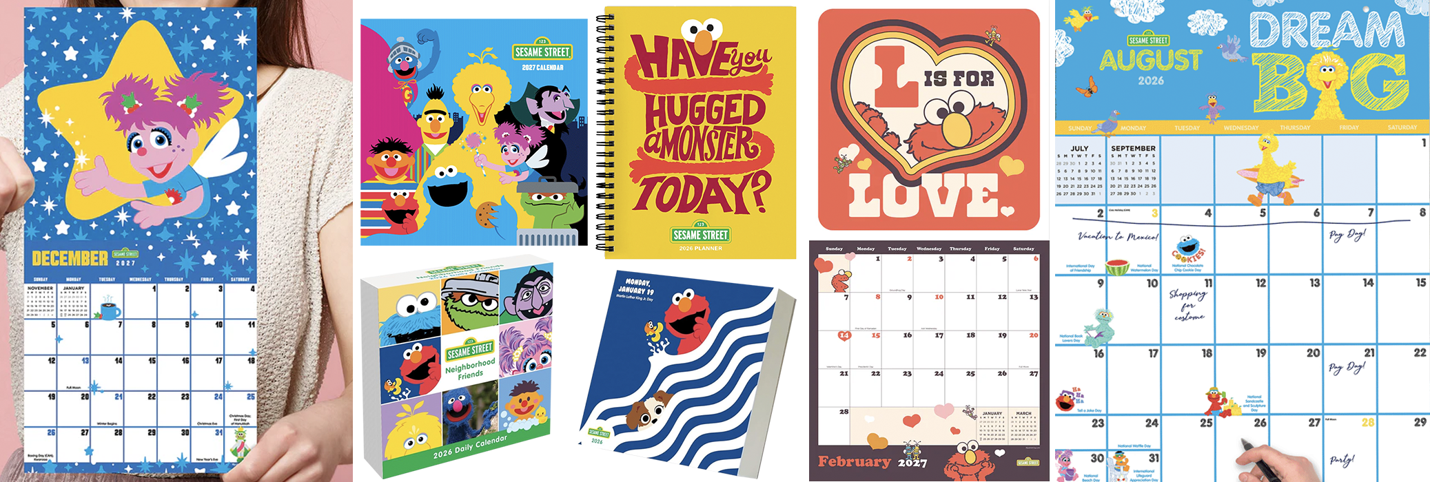 Collection of Sesame Street-themed calendars, planners, and notebooks featuring characters like Elmo, Big Bird, and Cookie Monster, with a pink background and a person holding a December 2023 calendar.
