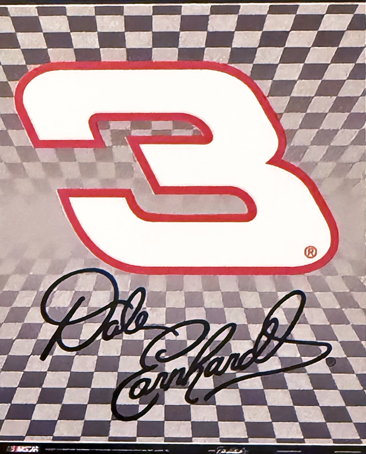 A large number three logo outlined in red on a checkered background, with a signature below that reads Dale Earnhardt.