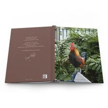 Open book with a photo of a rooster on a green leafy background.