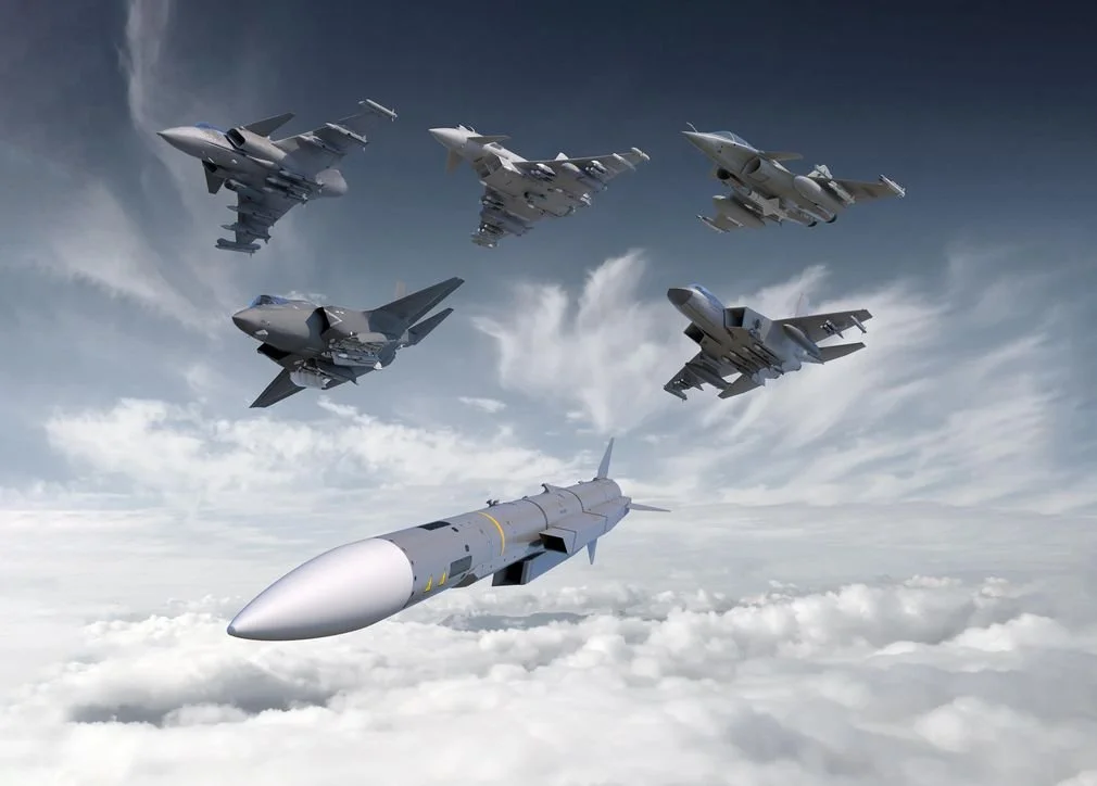 Several fighter jets flying in formation above the clouds, with one missile in the foreground.
