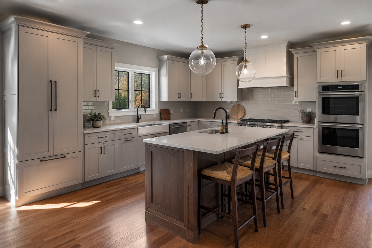 Modern kitchen with white cabinets, a central island with a wooden base, pendant lights, a window above the sink, stainless steel appliances, and hardwood floors.