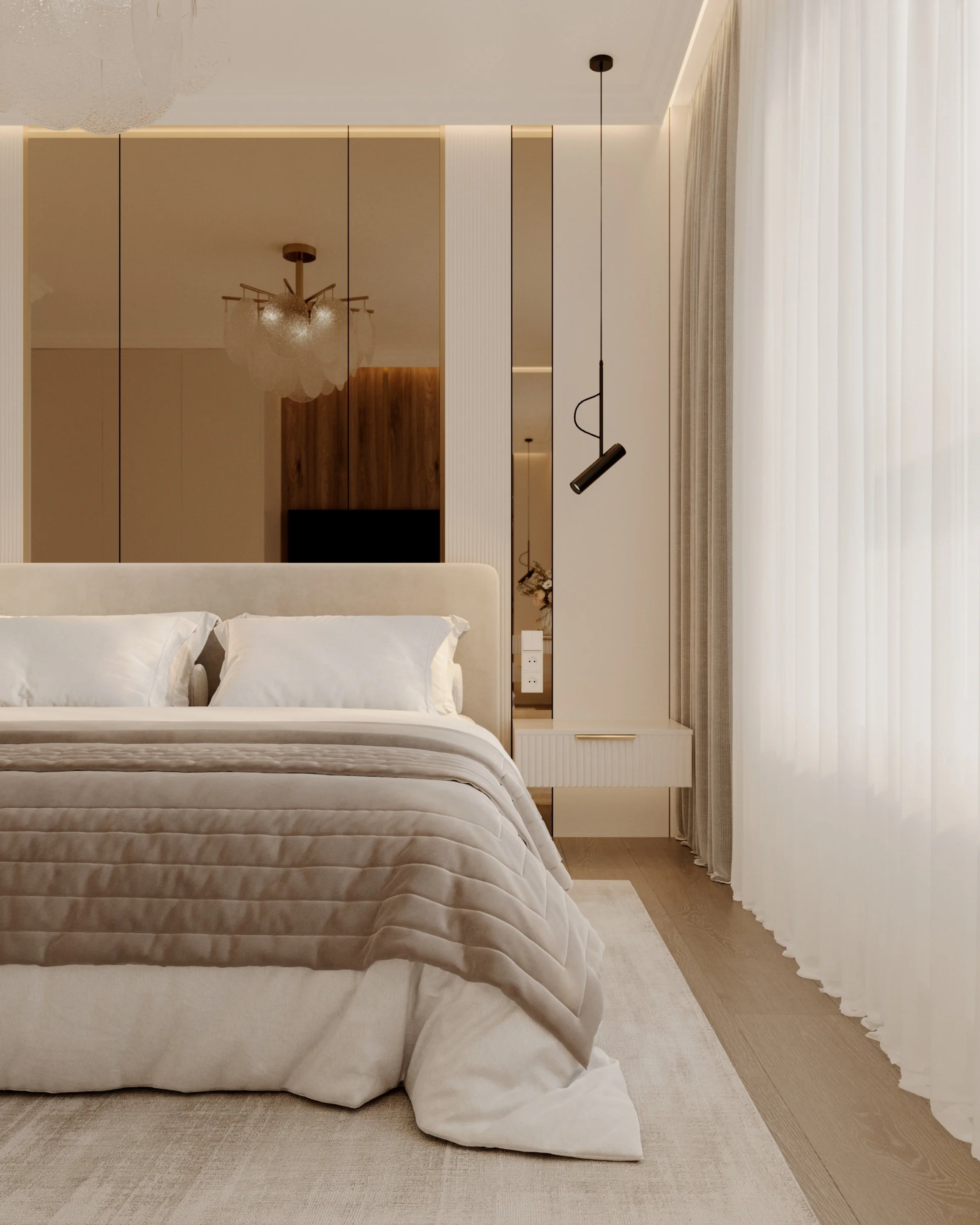 A bedroom with a large bed dressed in white bedding and pillows, a white and wood nightstand, a white rug, sheer curtains, a modern black pendant light, and a wooden wardrobe with beige and cream walls.