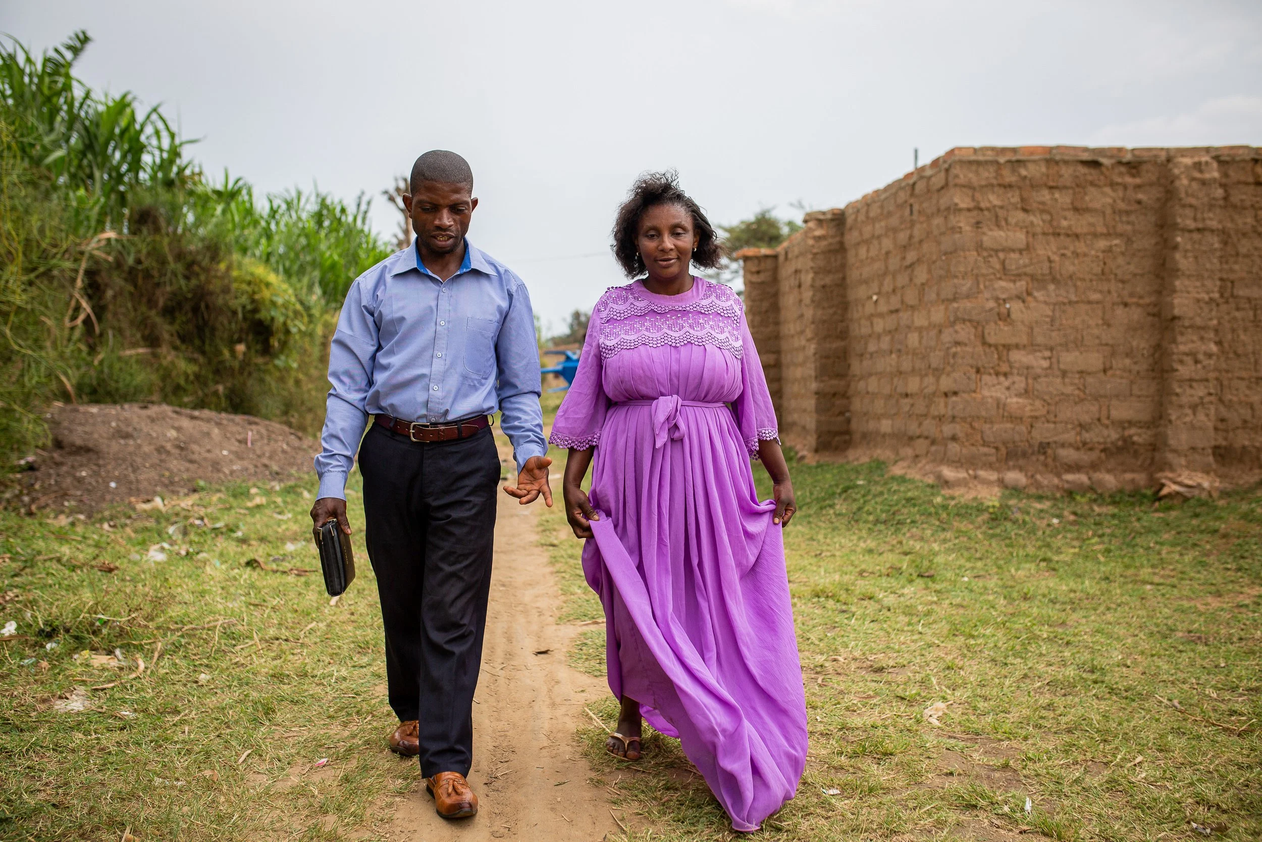Joshua and his wife walk hand in hand. 