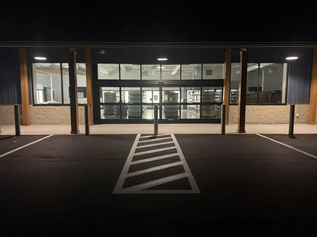 storefront with new parking lot paving and striping work