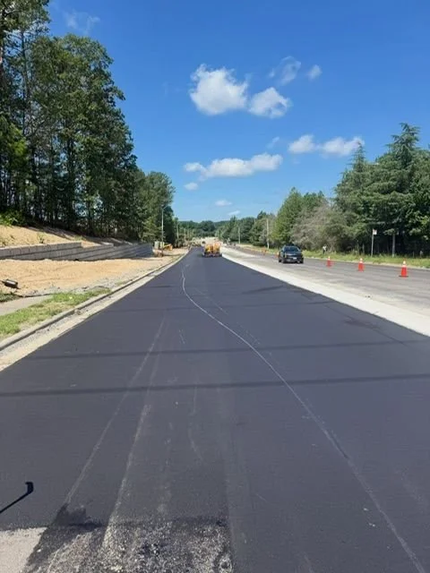 paved road with paving equipment
