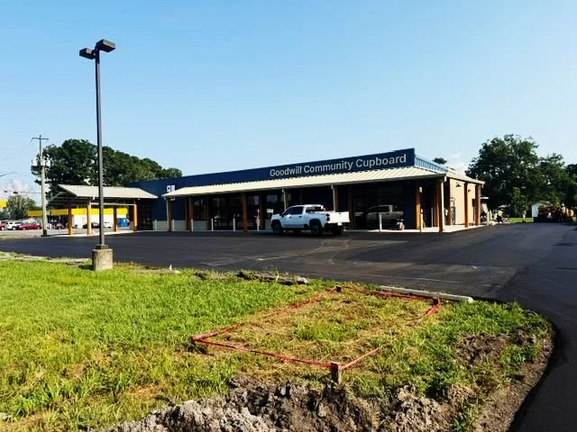newly paved parking lot into front of a Goodwill