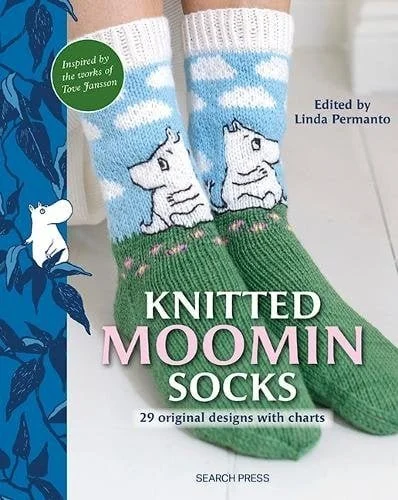 Cover of a book titled 'Knitted Moomin Socks,' featuring a photograph of green socks with white Moomin characters and a blue sky with clouds design. The book is edited by Linda Permanto and inspired by Tove Jansson.