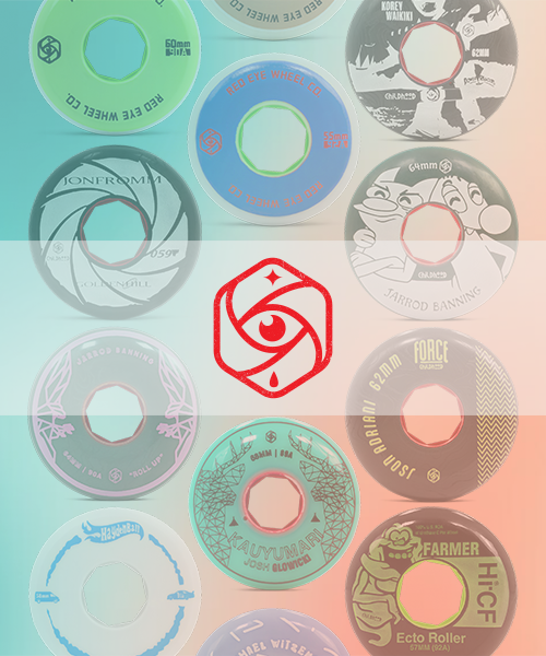 A collection of various Red Eye skateboard wheels with different designs and colors arranged on a flat surface.