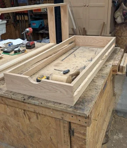 Red oak drawer components fitted in workshop