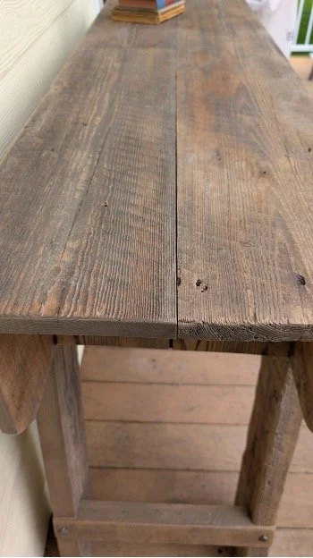 Weathered barnwood tabletop with natural grain and patina