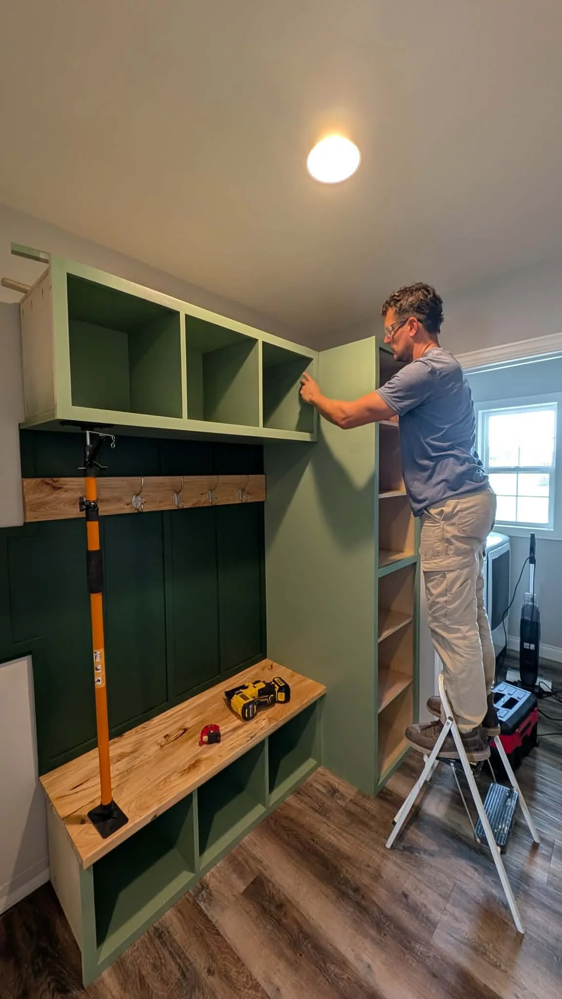 Installing upper cabinets in custom mudroom built-in