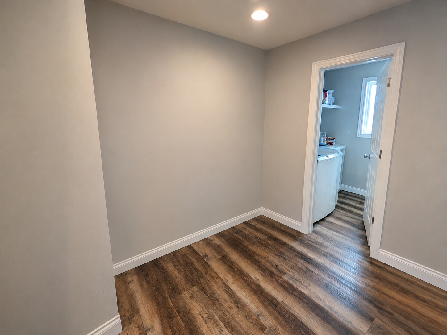 Empty mudroom wall space before built-in installation