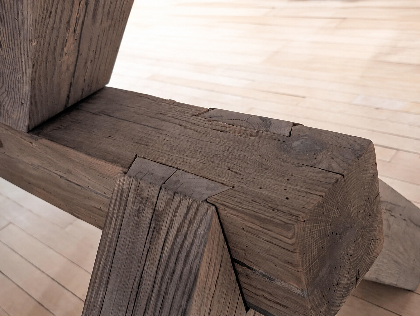 Stopped-dovetail joinery in oak trestle table base