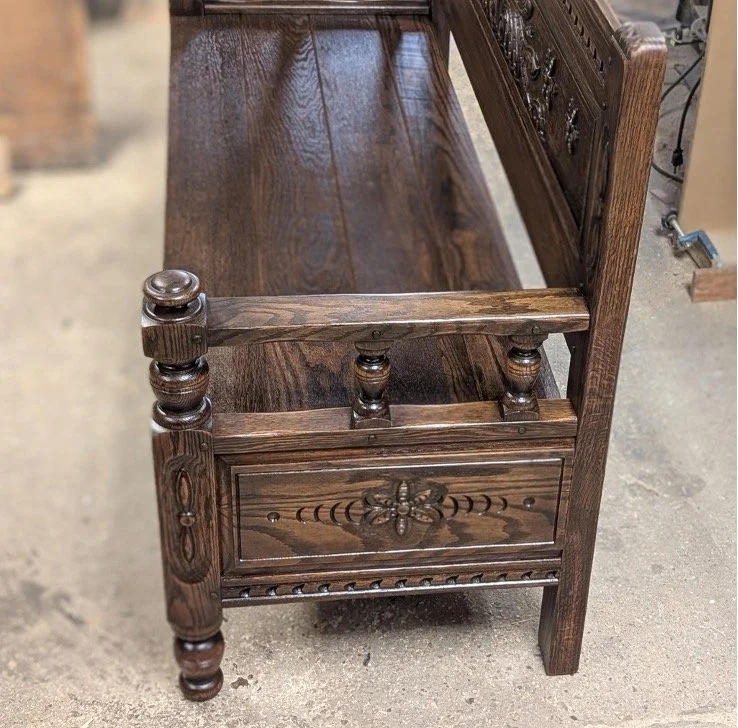 Finished side of the bench made from the antique bed footboard.