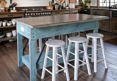 Custom kitchen island with concrete top and painted wood base
