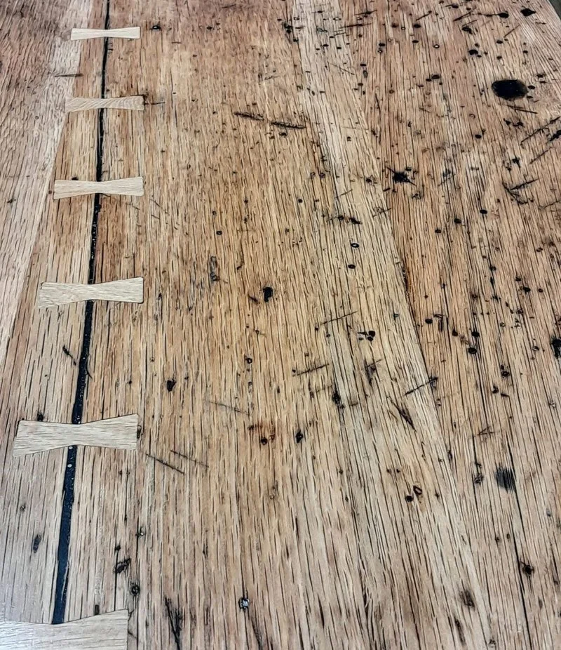 Closeup of bowtie joinery detail in reclaimed wood