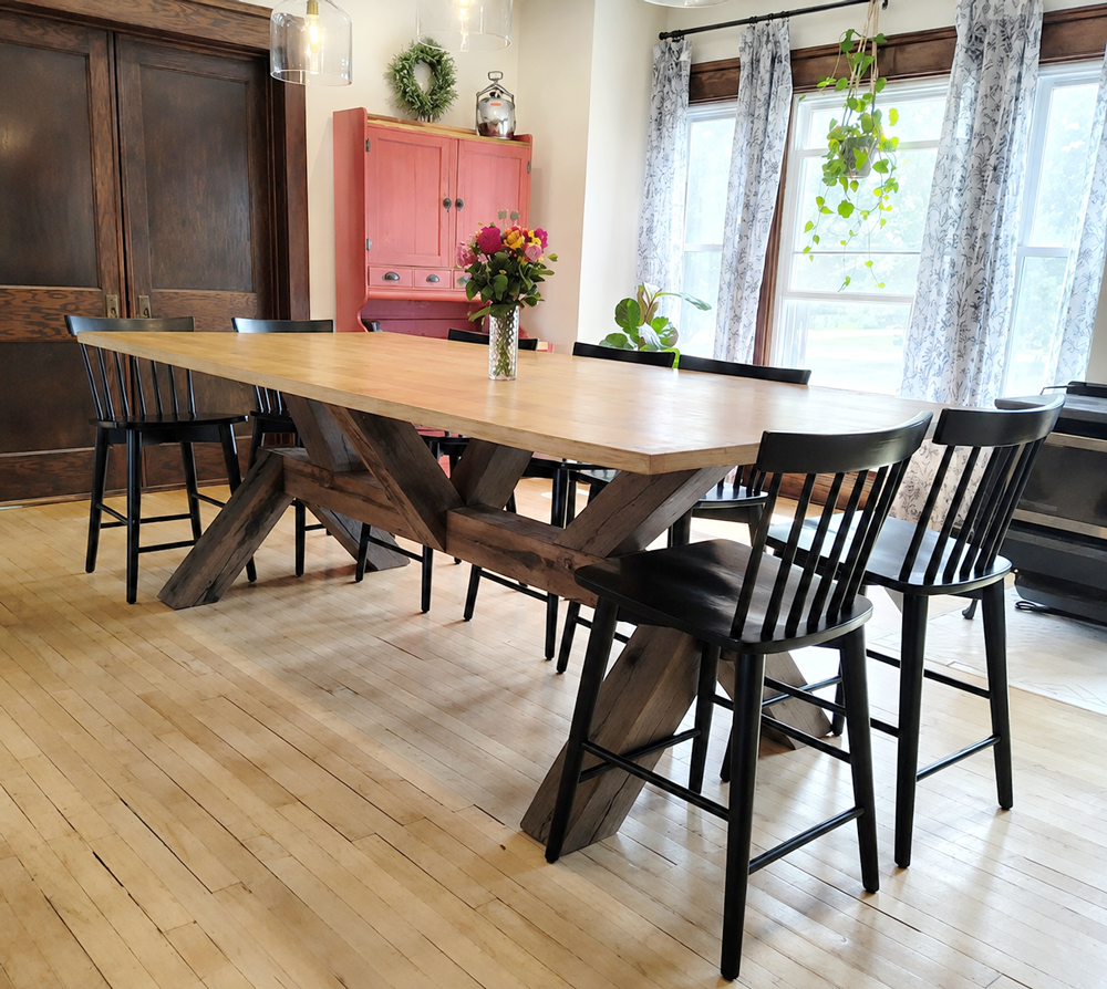 Oak gathering table set for family meals with decor