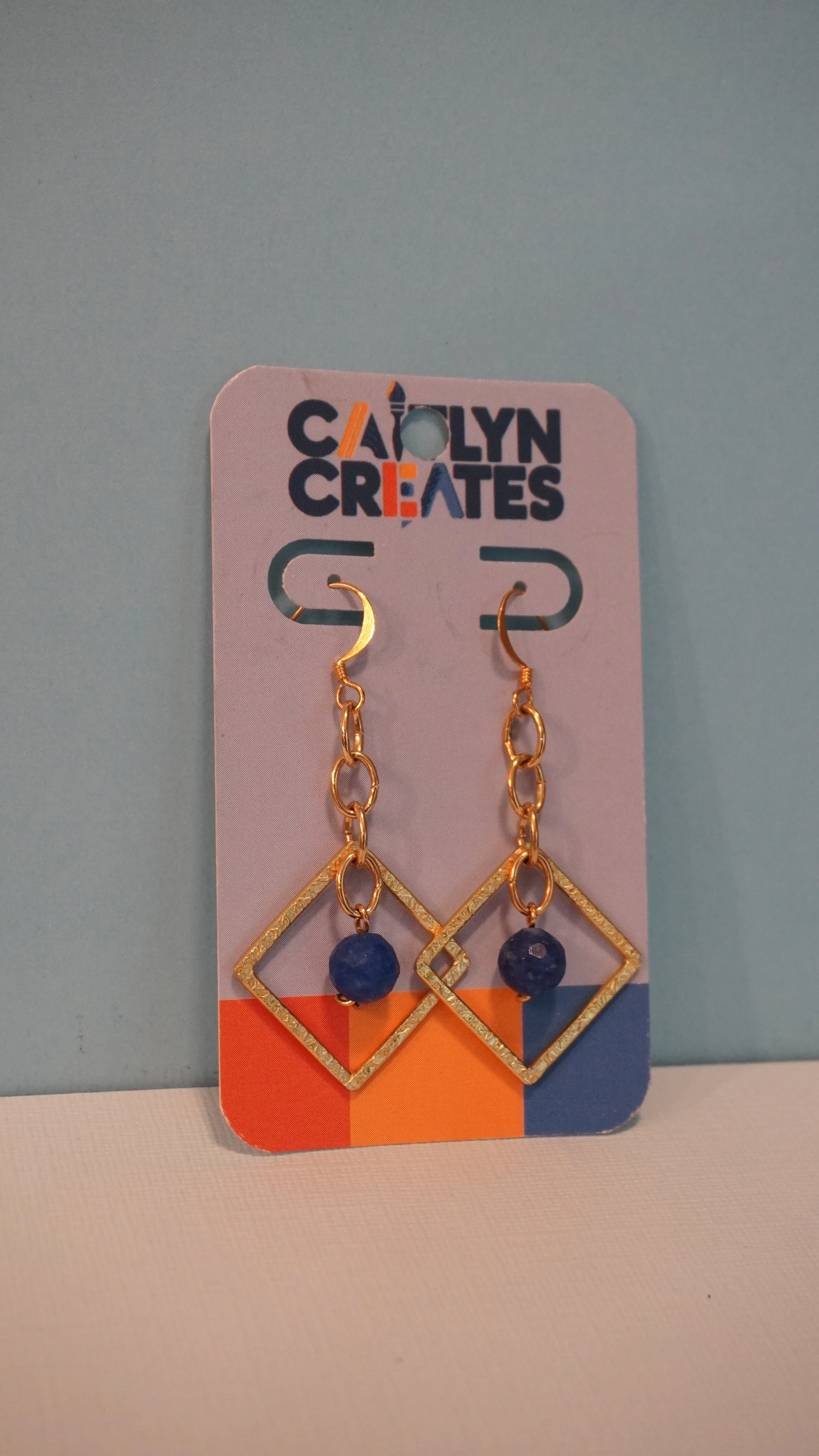 BLUE EYED DIAMOND EARRINGS