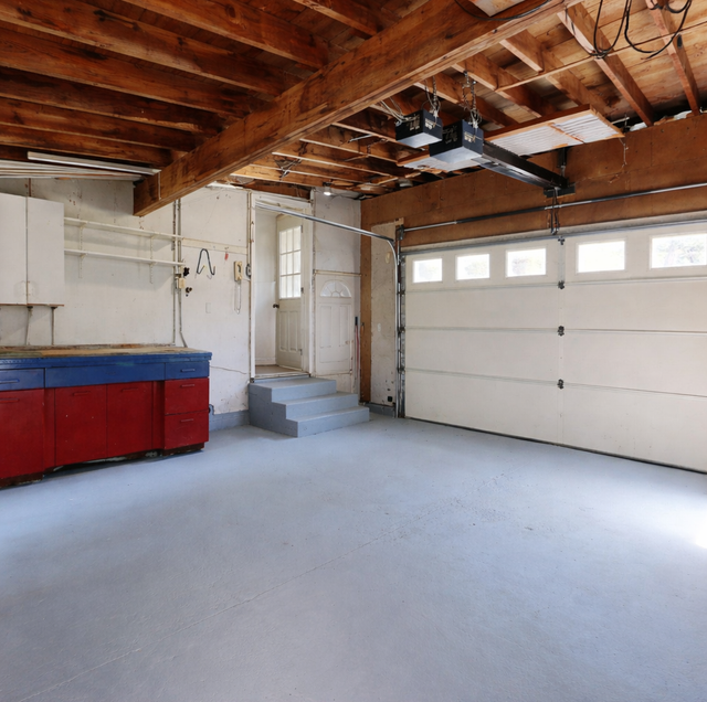 closed garage door with opener motor running overhead