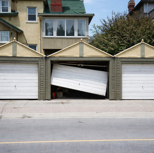 torsion-spring garage door with one side tilted crookedly