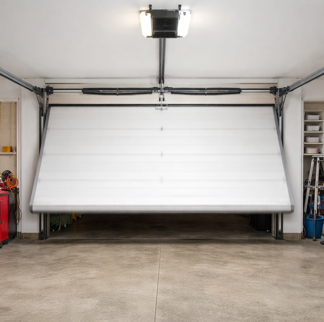 residential garage door slamming shut near concrete floor