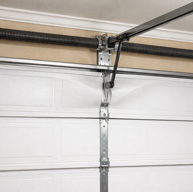steel garage door dented at opener arm bracket