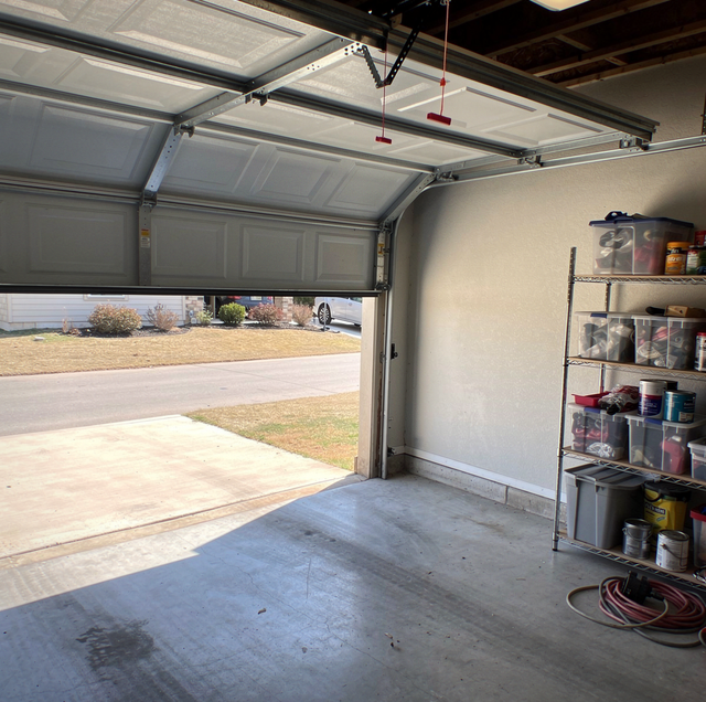 garage door gap near floor with opener rail above