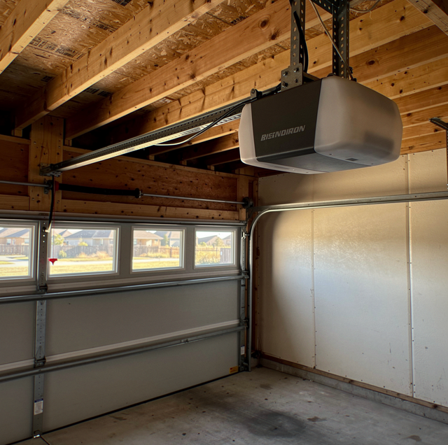 garage door opener powerhead mounted on steel rail