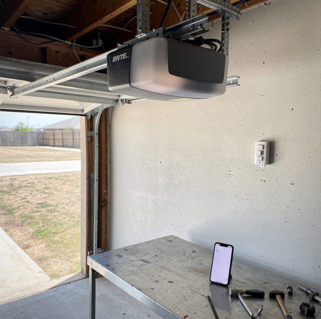 residential garage door opener remote on wall console