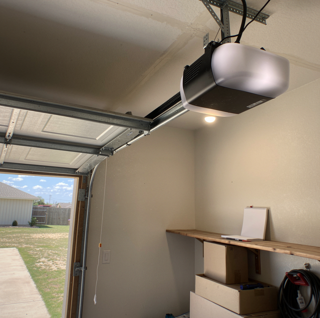 new sectional garage door paired with wall mounted opener