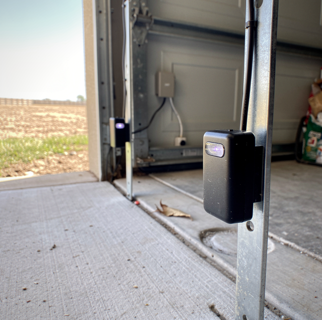 blinking garage door safety sensor light beside steady sensor