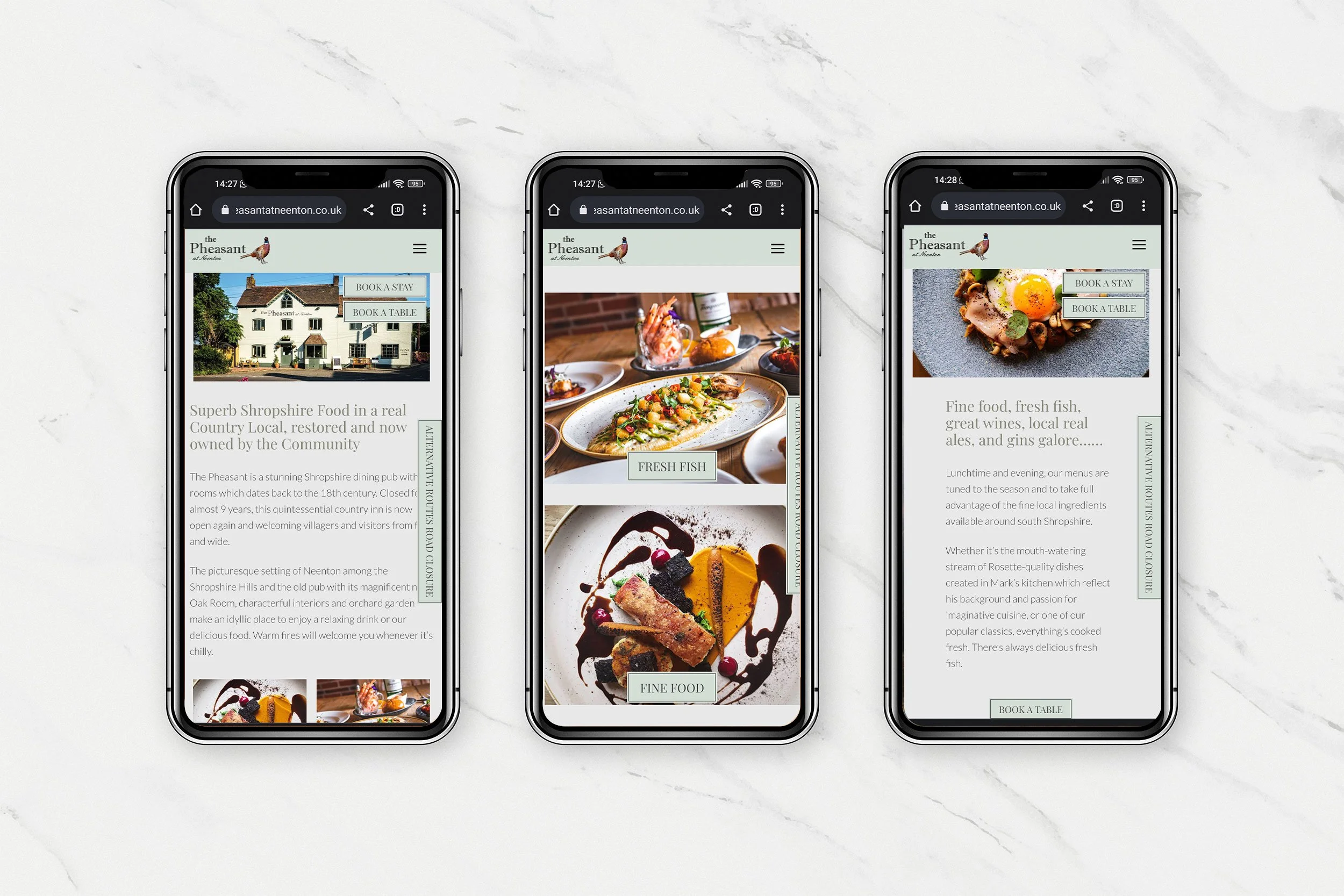 Three smartphones displaying a restaurant website called The Pheasant, each showing different sections with photos of food and text about the restaurant on a white marble surface.