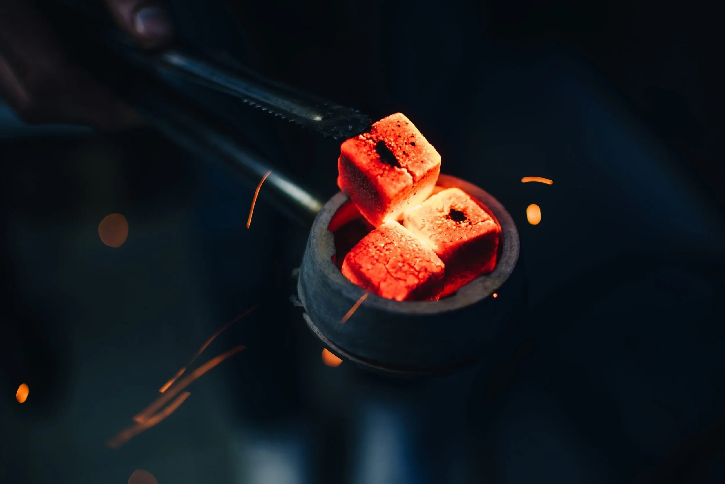 bowl-hookah-with-red-hot-coals-hands-hookah-scaled.jpg