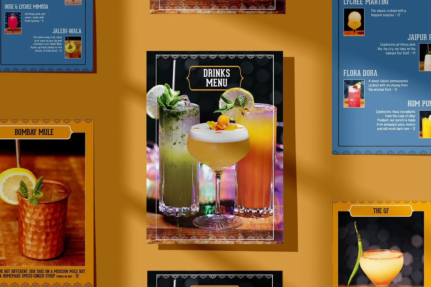 A menu displaying three colorful cocktails with garnishes, labeled as 'Drinks Menu,' including a green drink with mint, a yellow drink with orange garnish, and an orange drink with a lemon slice in a dark setting.