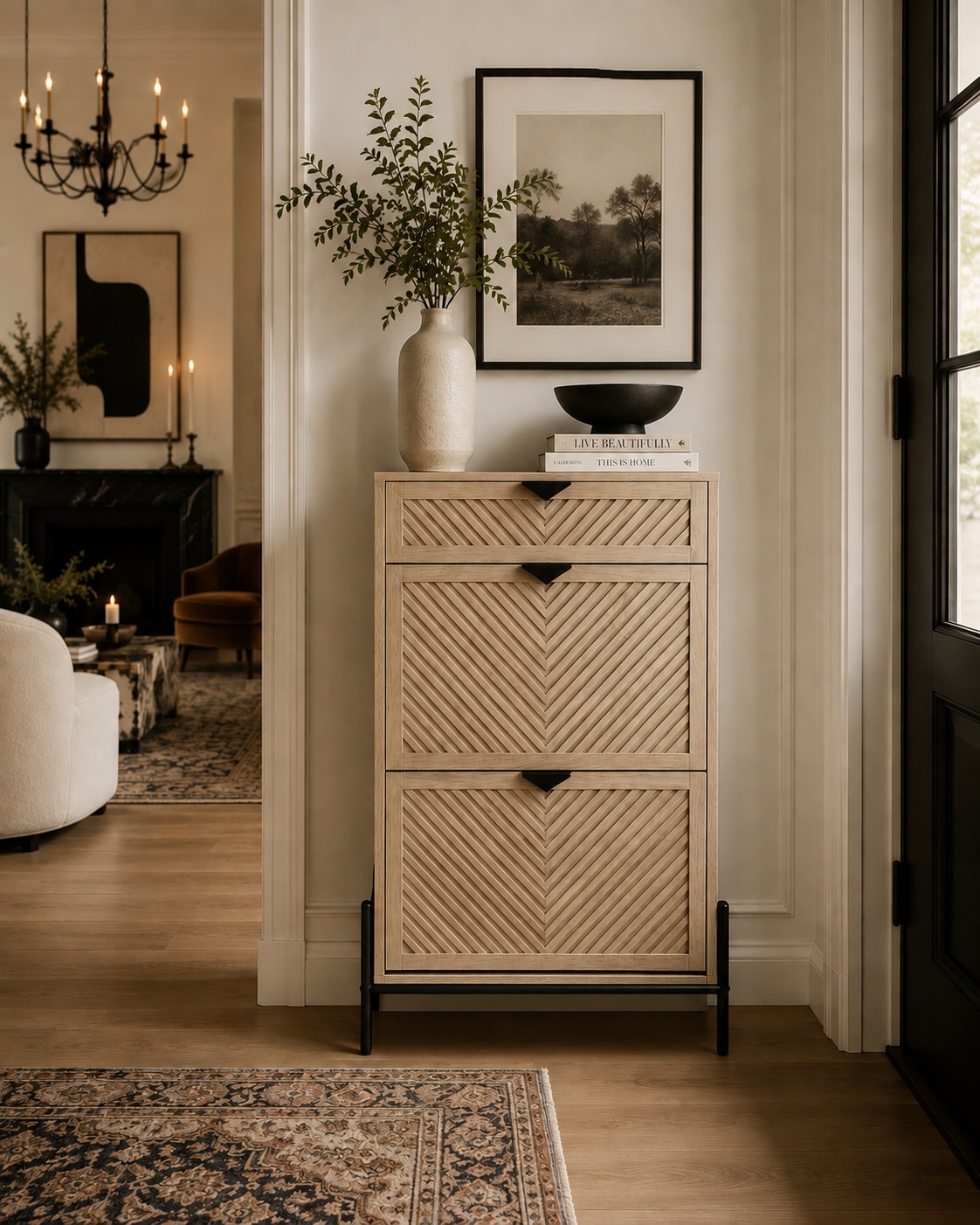 Modern wood shoe storage cabinet styled like an entryway console with greenery, books, and framed wall art.