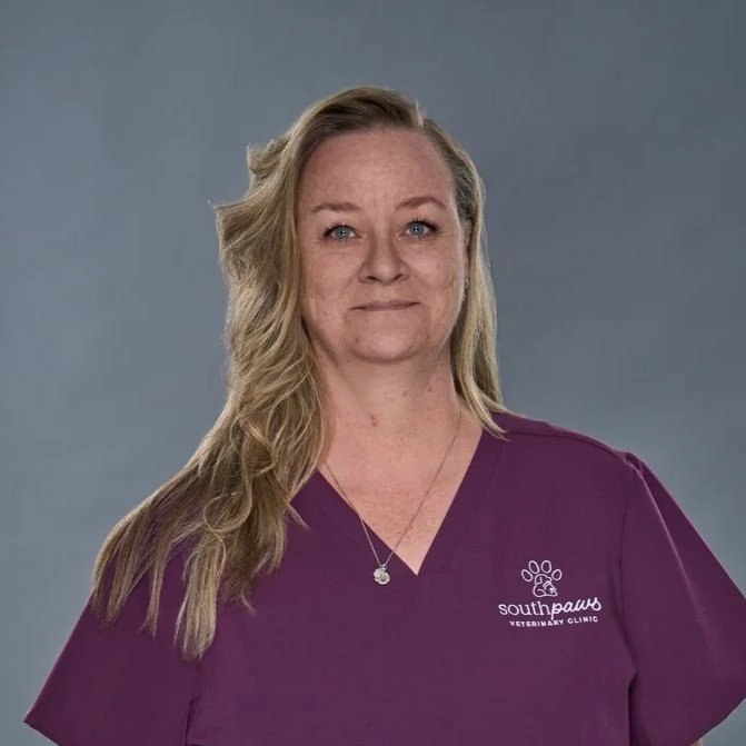 Cass headshot, woman in purple scrubs