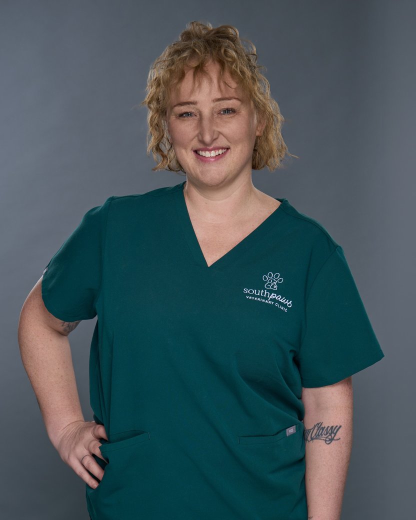 Charlene Headshot, curly hair with green scrubs