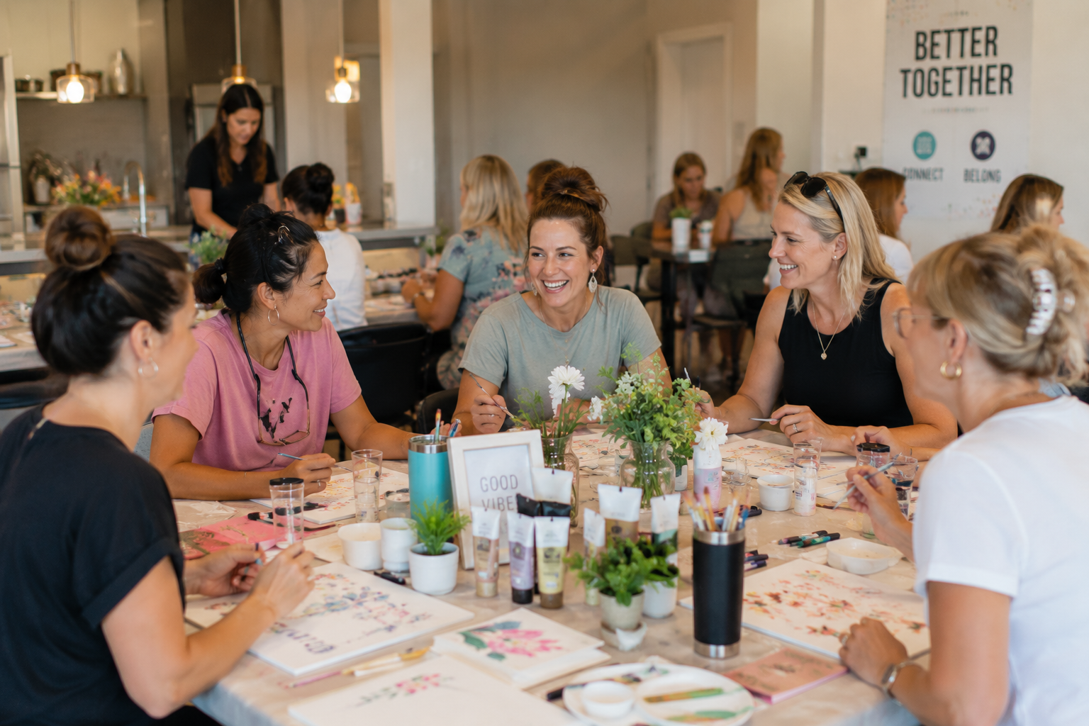 Residents enjoying a creative workshop while connecting, laughing, and building community during a Belivra Creative Resident Social.