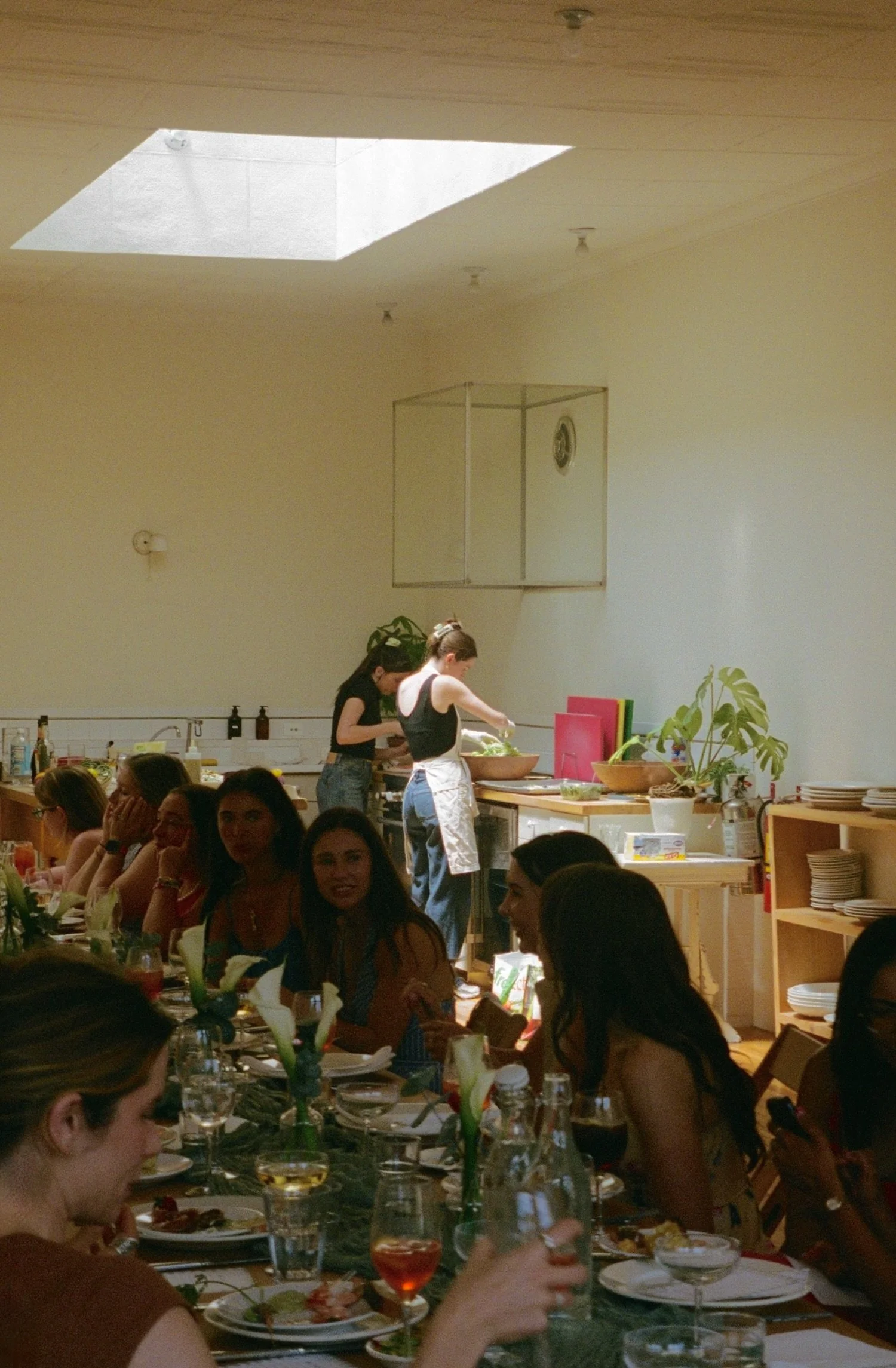 Chefs finishing lunch while the table is set
