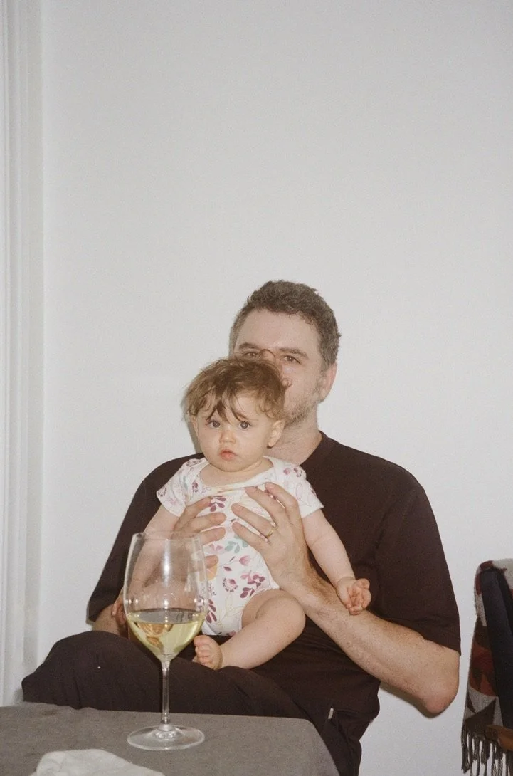 Father and baby with a glass of wine