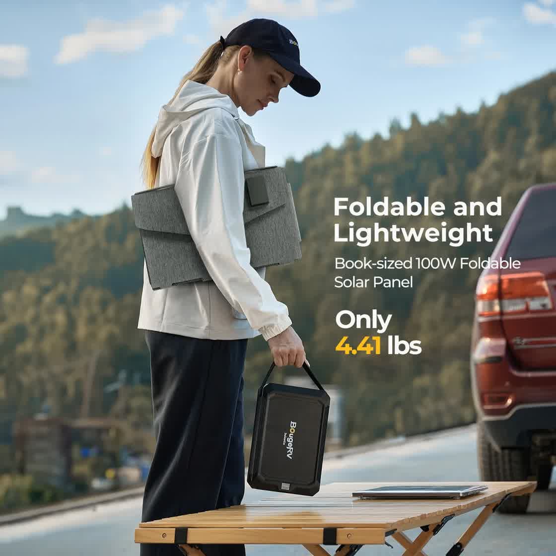 BougeRV 100W foldable panel lightweight at 4.41 lbs, carried by a hiker