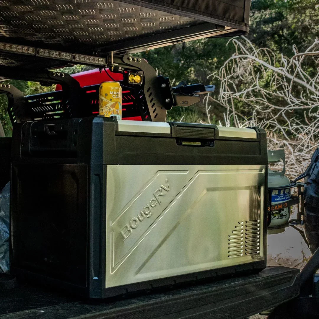 BougeRV Rocky 52L fridge in a vehicle boot at a campsite