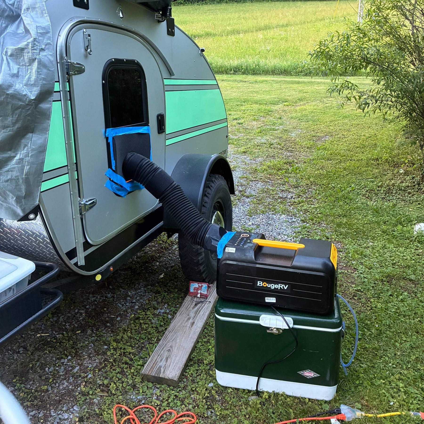 BougeRV PC35 air conditioner cooling a tent pitched beside a vehicle